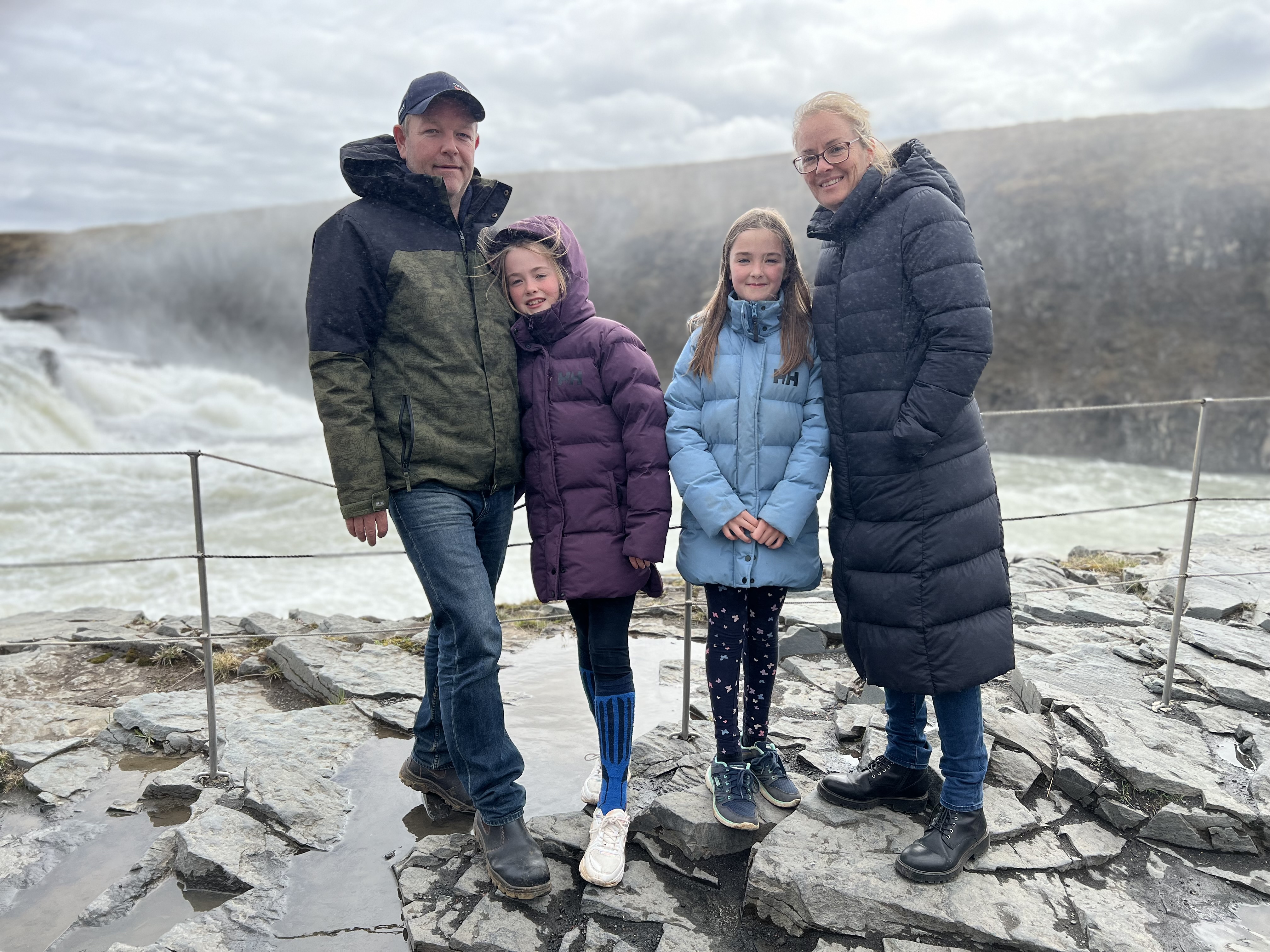 Family at the waterfall in Iceland